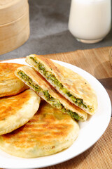 Pan-Fried Vegetable Dumplings with Green Filling on White Plate Asian Cuisine