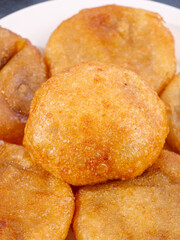 Golden Handmade Fritters - Traditional Old Fashioned Deep Fried Comfort Food on White Plate