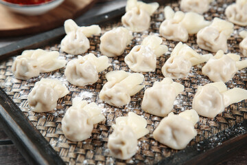 Handmade Wonton Dumplings on Bamboo Steamer Ready to Cook - Traditional Chinese Food Preparation