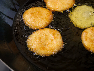 Handmade Donuts Deep Frying in Hot Oil - Traditional Sweet Pastry Cooking Process