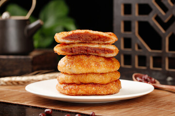 Handmade Old Fashioned Fried Sugar Cookies with Red Jam Filling Stacked on Plate