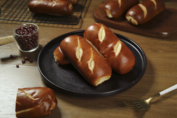 Handmade Lye Bread Rolls with Golden Brown Crust on Wooden Table Traditional German Baking