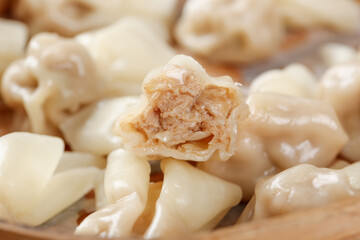 Handmade Fresh Ravioli Pasta with Meat Filling on Wooden Background