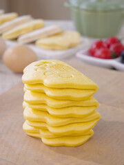 Golden Lotus Leaf Steamed Buns Stack with Breakfast Spread on Wooden Table