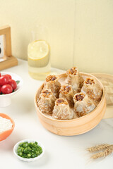Cantonese Pearl Wheat Siu Mai Dumplings in Bamboo Steamer - Traditional Chinese Dim Sum