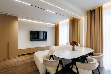 A modern living room with stylish decor and elegant lighting that enhances the space