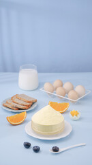 Healthy Breakfast Ingredients with White Milk Glass Eggs Bread Cheese Orange Blueberries Clean Minimal Food Photography