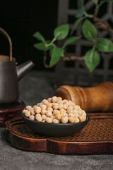 Raw White Peas in Black Bowl on Wooden Tray - Traditional Kitchen Ingredients for Asian Cooking