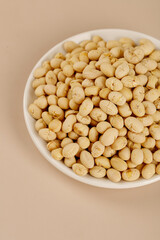 Crispy Fried Soybeans from Guizhou Province China - Golden Yellow Roasted Bean Snacks in White Bowl