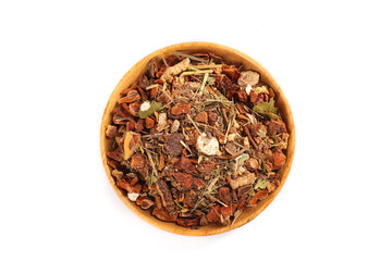 Hot spice collection with star anise, cinnamon and aromatic herbs in wooden pot bowl