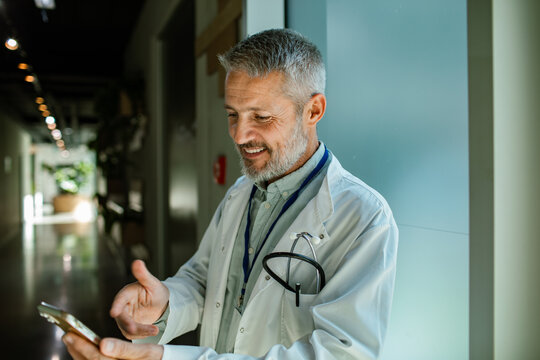Doctor using smartphone in hospital