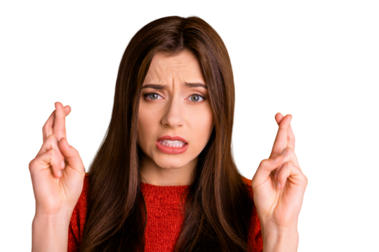 Close up photo of worried panic girlfriend about to cry with fingers crossed with her teeth trembling in fear isolated over vivid color background