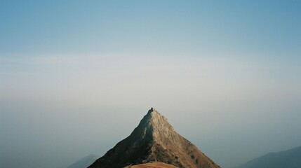 Serene Mountain Peak Under Clear Sky