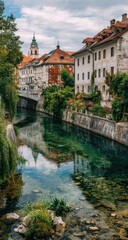Fototapeta premium Canal reflecting town buildings, trees, and sky
