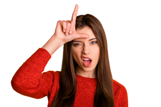 Photo of cruel rude bad school youngser showing you lose sign grimacing arrogant facial expression isolated over yellow vibrant color background