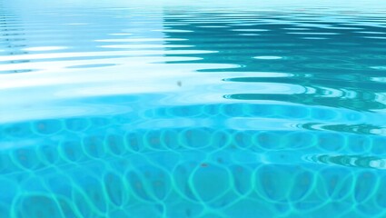 Obraz premium Turquoise Pool Water with Reflected Ripples and Tile Pattern Dis