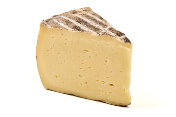 Tomme de Montagno Cheese Slice on Slate Plate, isolated on white background