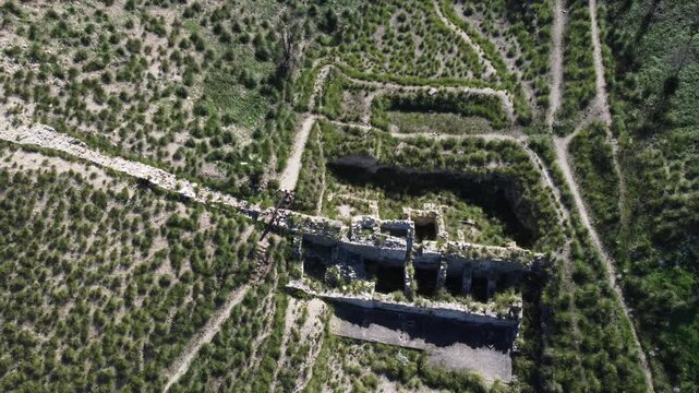 Stunning 4K footage of the Doric Temple of Segesta in Sicily, capturing the ancient Greek architecture surrounded by rolling hills, Mediterranean scenery, and bright summer sunlight in the Parco Arche