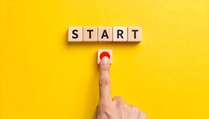 Motivation and action concept with start text and button on yellow surface.