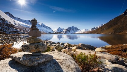 Stone Cairn By Snowy Mountain Lake