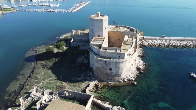 Aerial drone footage of Trapani, highlighting the seaside town, historic center, harbor, and stunning Mediterranean coastline under clear sunny weather
