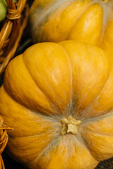 A vibrant yellow pumpkin, showcasing its unique and appealing texture, perfect for fulfilling autumnthemed decor