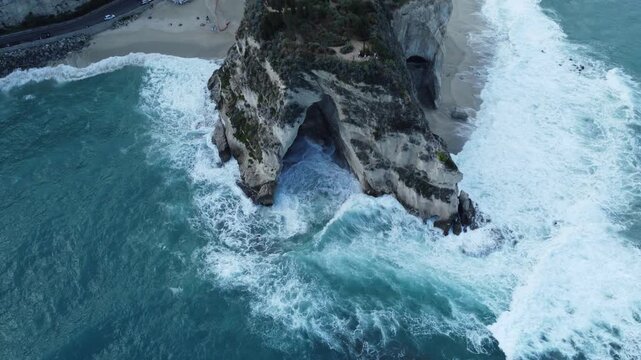 Aerial drone footage of Tropea in Calabria, featuring the dramatic cliffside town, turquoise sea, sandy beaches, and the iconic Santa Maria dell&rsquo;Isola monastery
