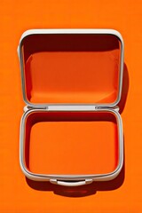 Empty lunchbox. Open on orange background. Food storage, school, picnic, travel use