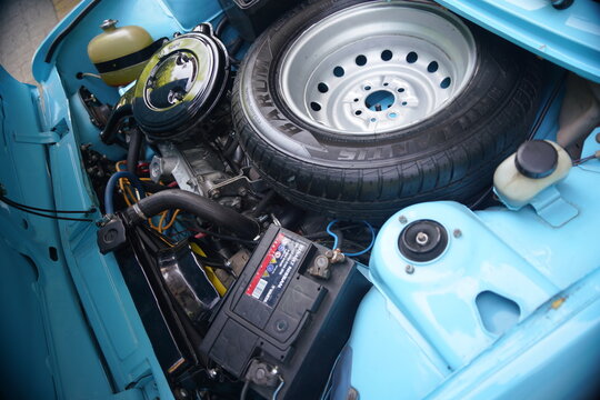 Engine bay of the Zastava 101 (Skala, Stojadin) - the spare tire positioned directly over the engine. Focus on safety hazard in a front-end crash. 08 June 2025 Subotica, Serbia
