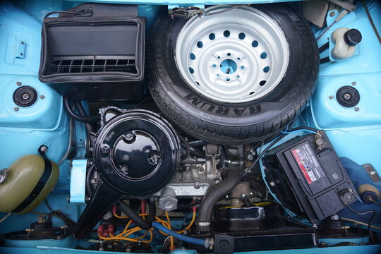 Engine bay of the Zastava 101 (Skala, Stojadin) - the spare tire positioned directly over the engine. Focus on safety hazard in a front-end crash. 08 June 2025 Subotica, Serbia