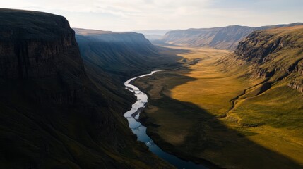 Majestic river cutting through vast valley iceland aerial view nature's splendor scenic landscape