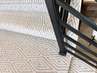 Neutral Carpeted Stairs With Black Rail Detail
