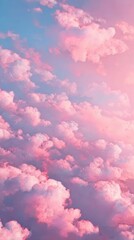 Fototapeta premium Pink cotton candy cloud texture, fluffy and sweet for dreamy backgrounds. Use for digital content, social media, and playful projects.