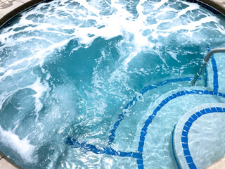 Top view of foamy water in outdoor hot tub