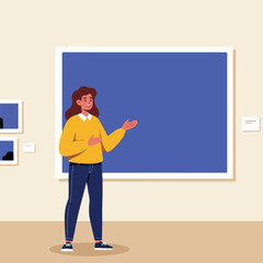 Fototapeta premium Woman presents art in gallery, gesturing to large blue canvas on wall
