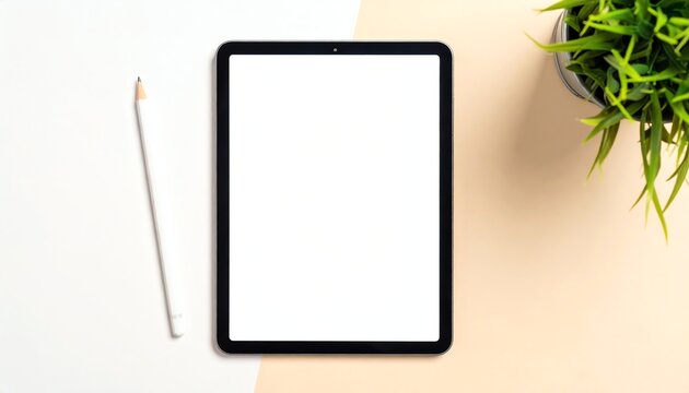 Modern tablet pencil workspace plant on bright minimal desk, perfect for creative, digital, or educational concepts with copy space.