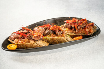 Bruschetta trio with beef and spicy peppers