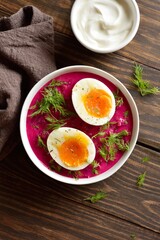 Homemade cold summer beet soup with cucumbers, dill and egg