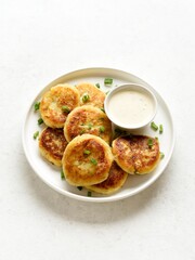 Potato pancakes made from mashed potato and green onion served w