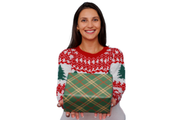 Woman in christmas sweater smiling, holding festive present, celebrating winter holiday season