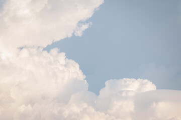 White fluffy cumulus clouds podium on blue sky with empty space background.Beauty cosmetic product placement pedestal present promotion minimal stand display,dreamy concept.