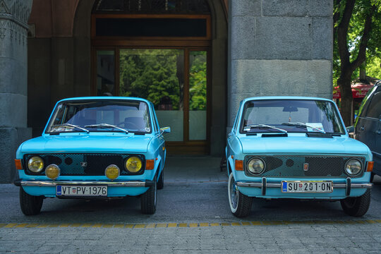 Two light blue classic Zastava 101 (FIAT 128, Stojadin, Skala, Yugo) cars parked side-by-side. Yugoslavian automotive history, nostalgia and timeless retro design. 08 June 2025 Subotica, Serbia