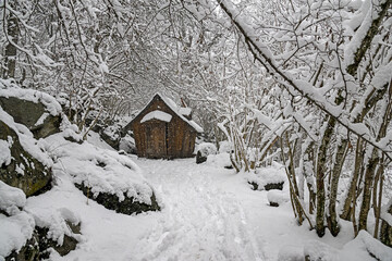 Witch’s cabin among footprints and snow in Tredòs (Aran Valley, symbolic figure)