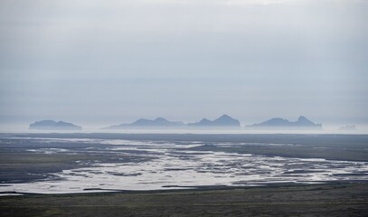 View from a hill, view over alluvial land with rocks, meandering river, Dímonarhellir, Suðurland, Iceland