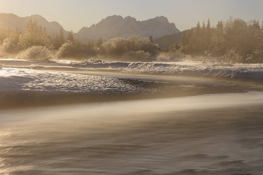 Wild river, riverbed, winter, snow, hoarfrost, backlight, fog, long exposure, Isar, view of Zugspitze, Wetterstein range, Bavaria, Germany