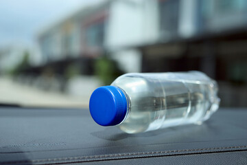 A bottle of water in the car