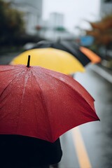 Vibrant umbrellas in rain city landscape reflecting urban mood on a gray day