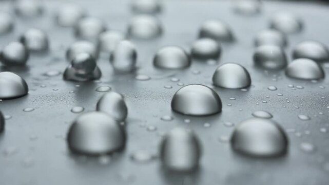 Mesmerizing Macro Slow Motion of Water Droplets on a Smooth Surface.