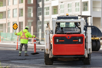 Construction site, laying new asphalt road pavement road construction machinery on highway