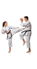 Young happy woman and young man competing in karate training in dynamic pose, isolated on white background
